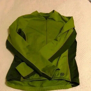 Novara cycling Jersey.  Zippered front with two open pockets on back.  Size M